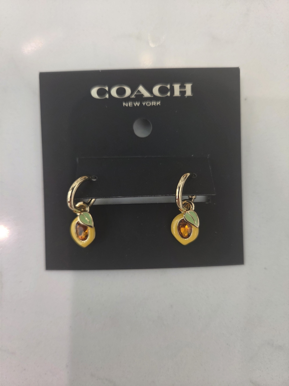 Coach Gold-Tone Peach Drop Hoop Earrings with Yellow Enamel